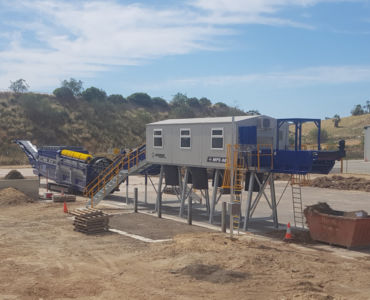 separating with a trommel and picking station