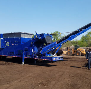 Mobile trommel screening wet compost