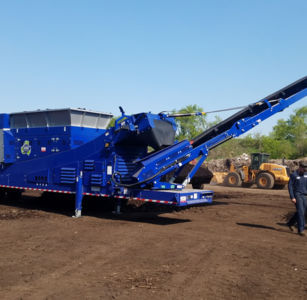 Mobile trommel screening wet compost