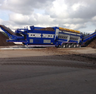 large trommel screen working on compost